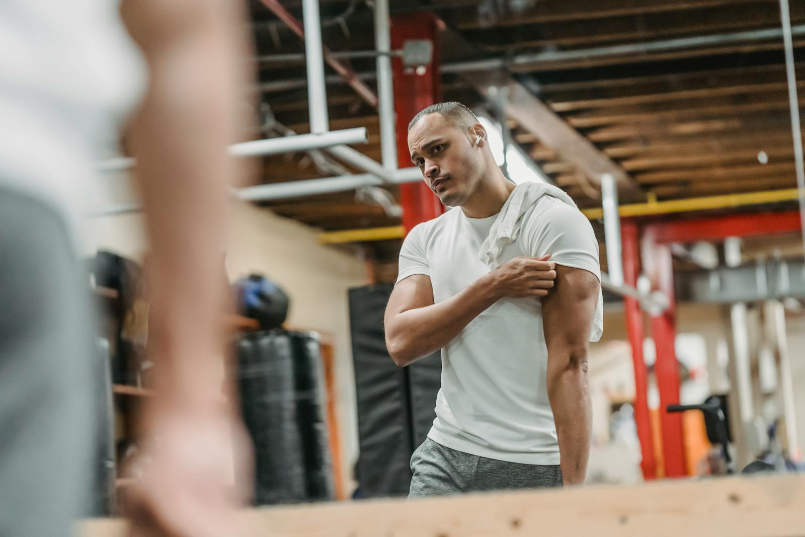 A man looking in mirror to see if hit his natural limit to muscle gains