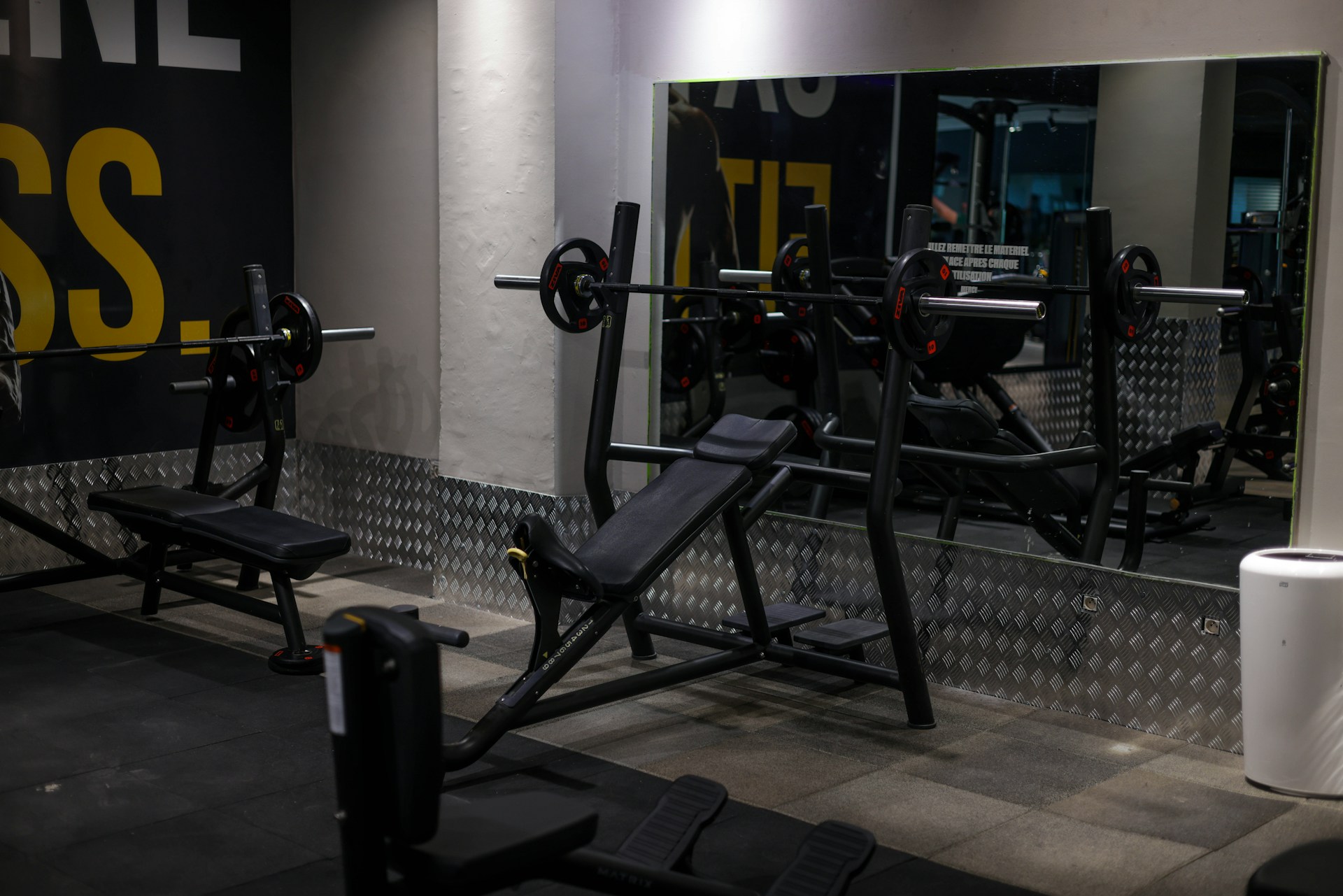 An incline bench set up at a gym